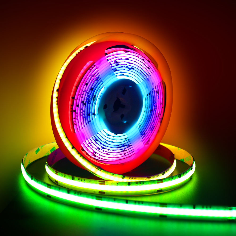A reel of RGB COB LED strip light emitting vibrant colors including blue, pink, red, and green, ideal for decorative and ambient lighting applications.