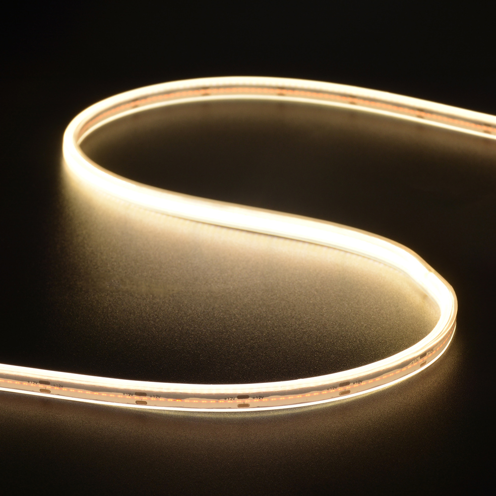 Flexible **Outdoor COB LED Strip Lights** in warm white, perfect for seamless lighting along pathways, patios, or any outdoor space.