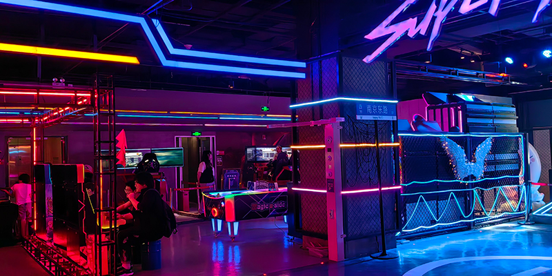 Vibrant arcade with neon lights, modern gaming environment