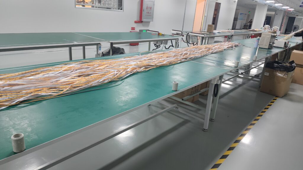 LED strip lights assembly line in a factory, with strips neatly arranged