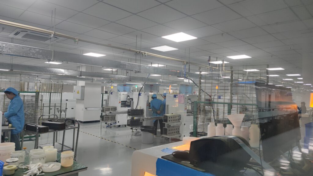 LED strip light factory with workers and automated production equipment