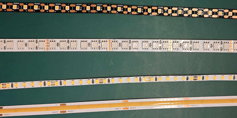 LED strip, designs, layouts Various types of LED strip lights with different designs and layouts on a green surface