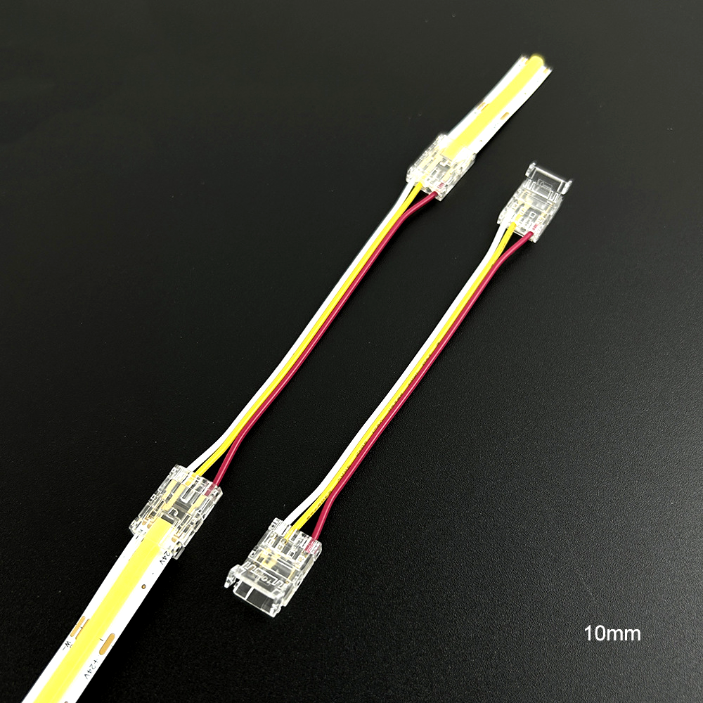 Transparent 3-pin connector for 10mm CCT COB LED strip lights, shown with yellow, red, and white wires for adjustable color temperature applications. Includes two connection ends for dual strip linking or controller extension.
