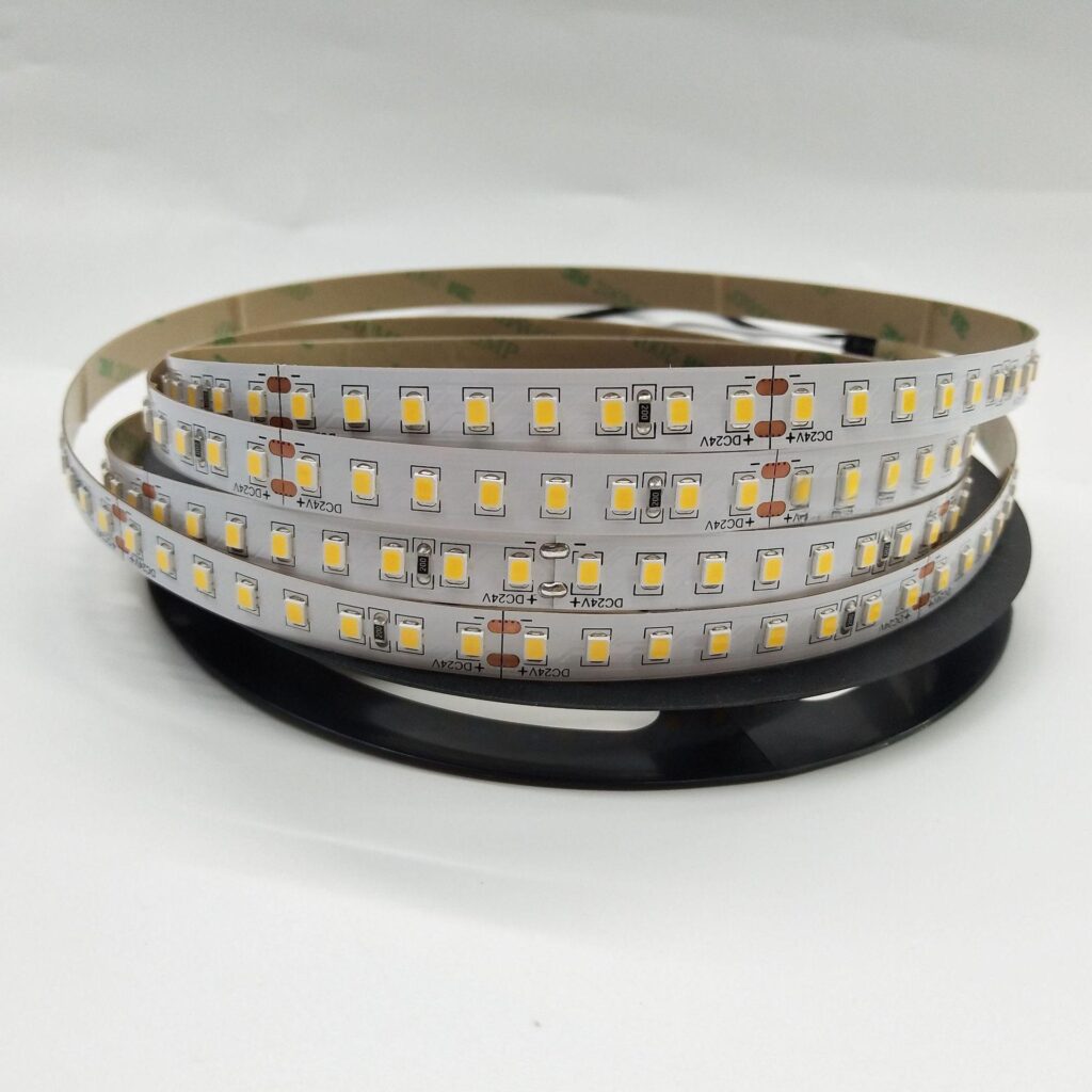 10mm wide standard SMD LED strip light rolled on a black plastic reel, featuring 24V LED chips on a grey PCB.
