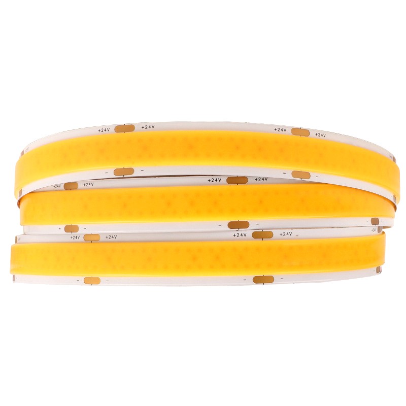 Close-up of a coiled 24V COB LED strip light with yellow phosphor coating and clearly marked cutting points.