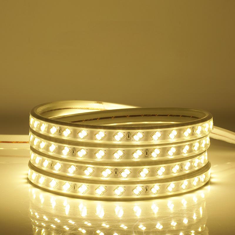 Yellow LED strip light with SMD LEDs in a flexible, waterproof IP67-rated housing, coiled for easy storage