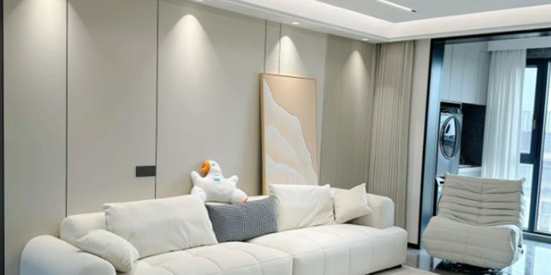 Minimalist living room lighting Modern living room with white sofa, minimalist design, and soft LED lighting