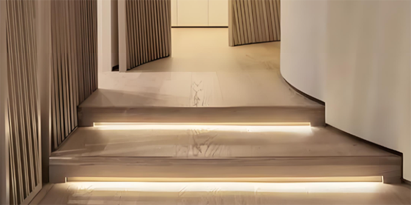 Modern staircase design LED lights illuminating staircase steps in modern interior
